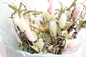 Bride or bridesmaid wedding bouquet of dried flowers in green and pink colours