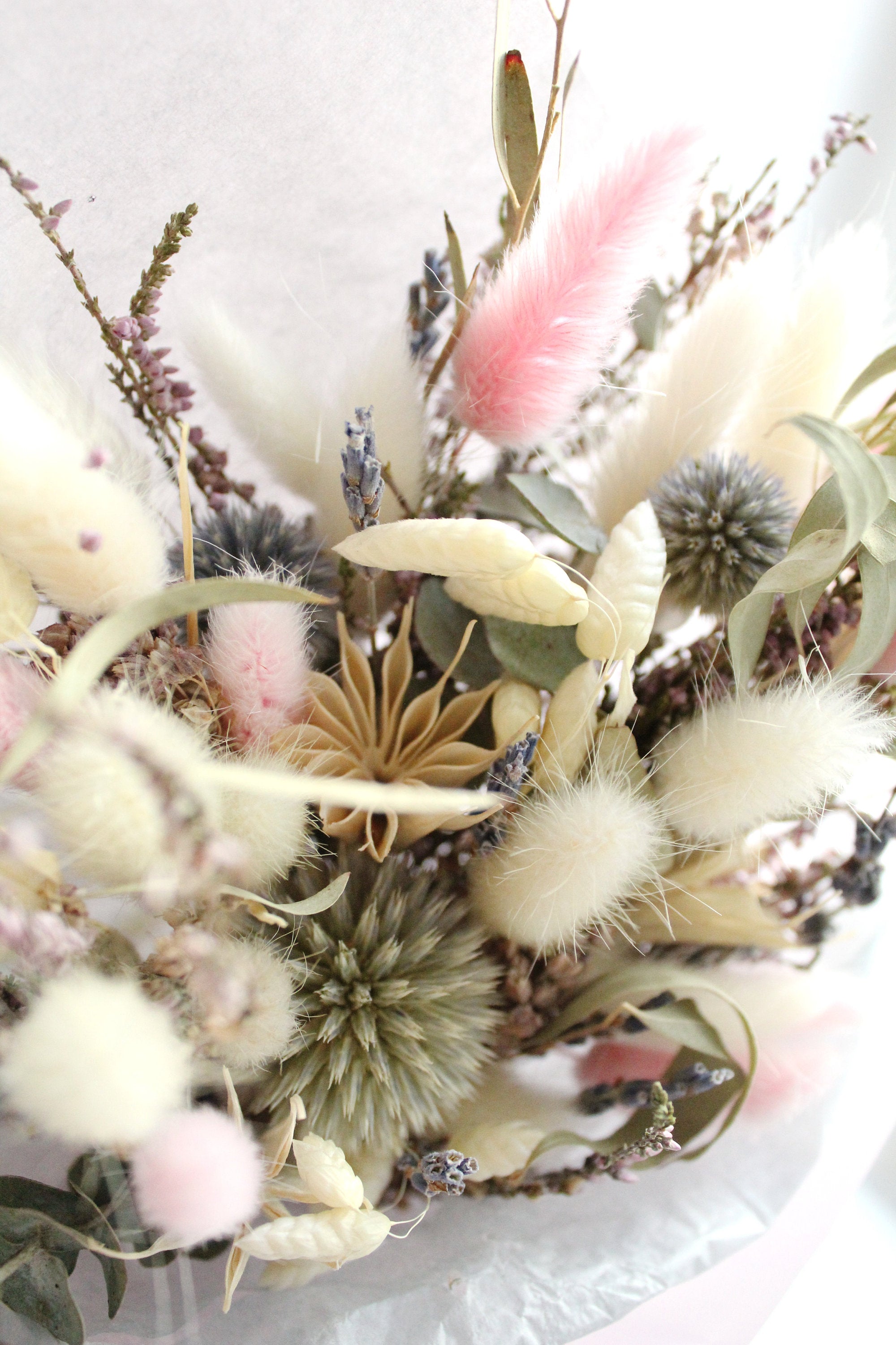 Bride or bridesmaid wedding bouquet of dried flowers in green and pink colours