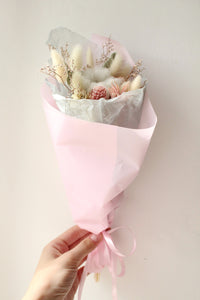 Small bride or bridesmaid wedding bouquet of dried flowers in green and pink colours